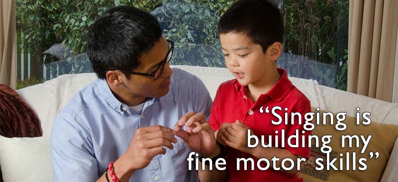 Children playing with a spider song activity